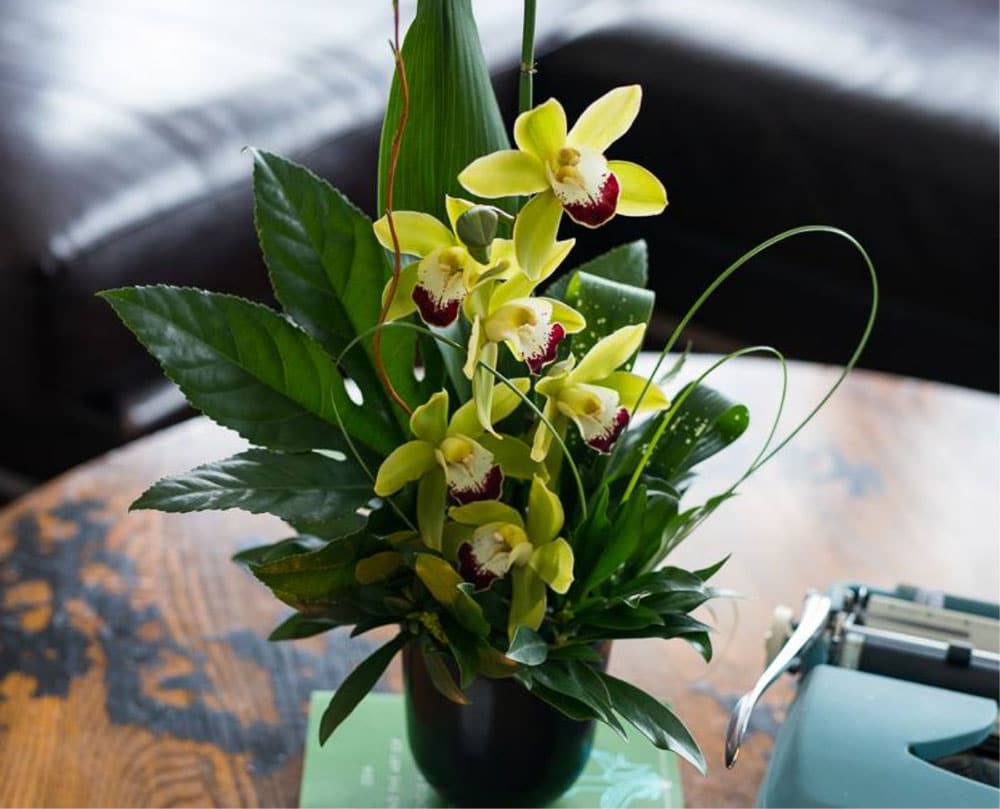 A close-up of flower bouquets on an office table